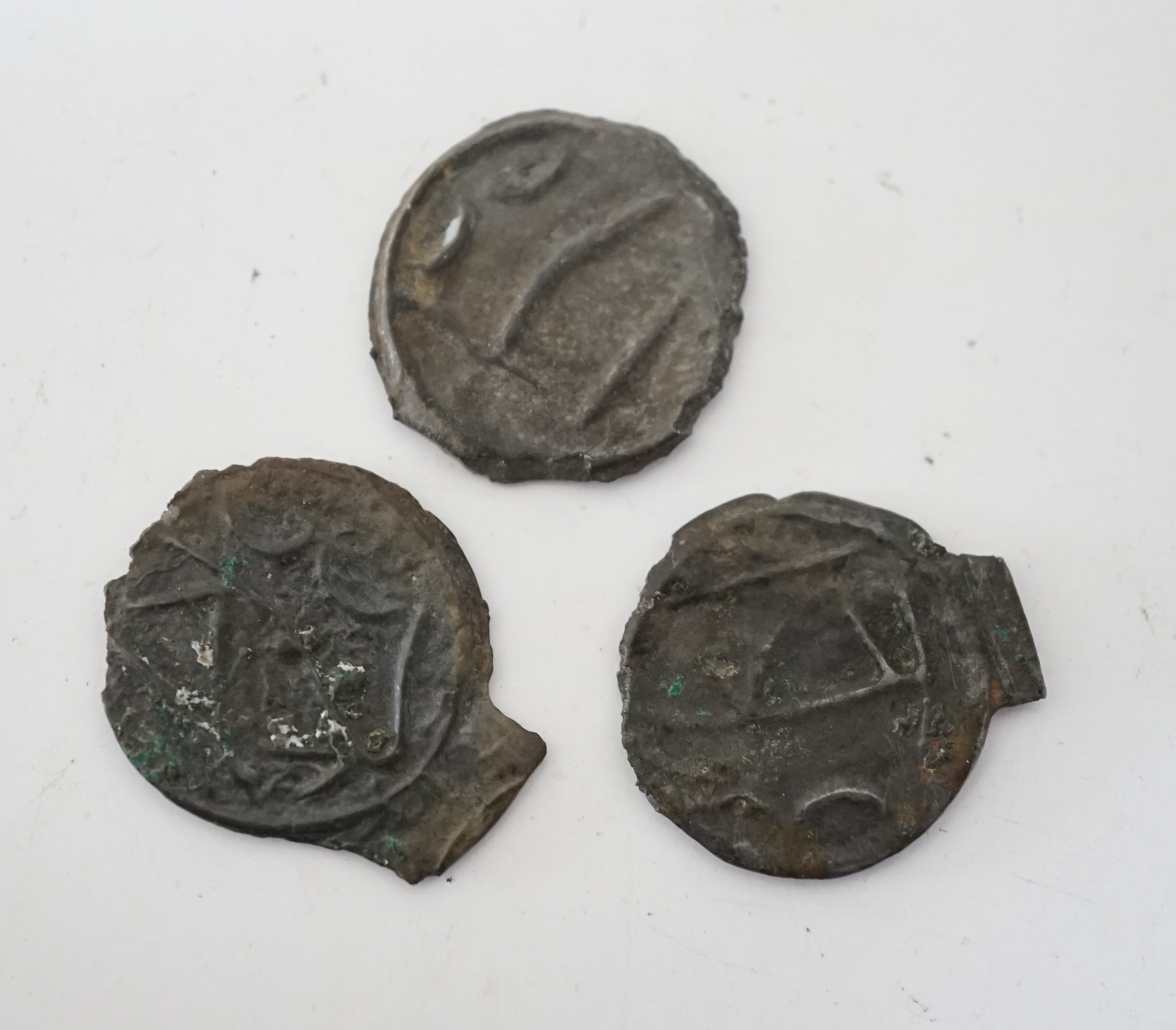 British Celtic coins, three copper/tin alloy potins (S63), stick bull and stick head designs, some encrustation otherwise VF, 1.16 to 1.6g, with label stating that they were found in Warlingham, Surrey